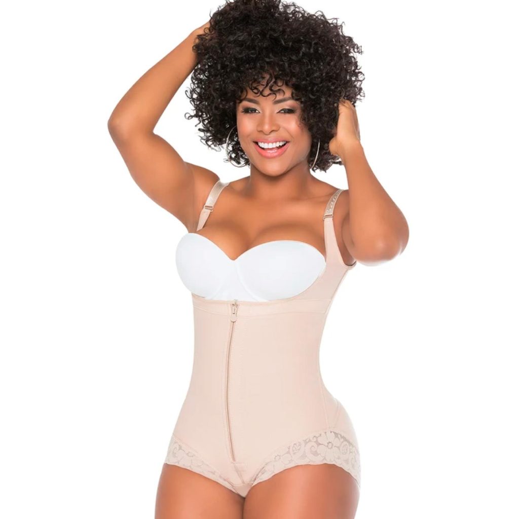 Woman wearing a beige open-bust compression bodysuit with adjustable straps and front zip closure.